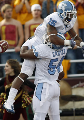Kendric Burney (top) may have less-than-ideal size and Bruce Carter has to overcome injuries. (US Presswire)