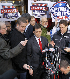 With some fans showing their sentiments behind him, Jeff Pash of the NFL meet the media after the union breaks off talks. (AP)