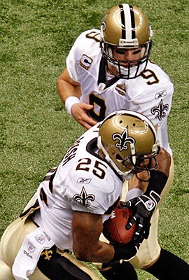 Drew Brees, a veteran of similar situations, is trying to convince Reggie Bush the Saints' move is good for him. (Getty Images)