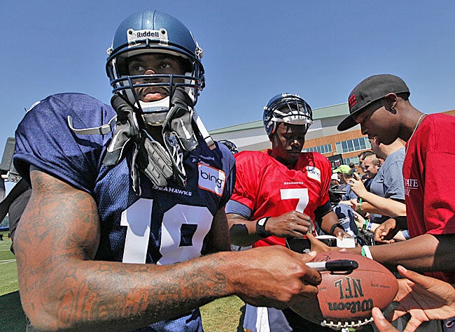 Sidney Rice and Tavaris Jackson are on board in Seattle. But questions abound. (AP)