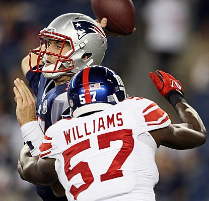 The Giants' defense harasses backup QB Ryan Mallett as the Patriots fall in their last preseason game. (Getty Images)