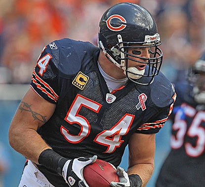Brian Urlacher crosses the goal line with a recovered fumble, one of two turnovers he recorded against the Falcons. (Getty Images)