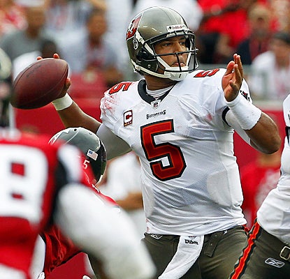 Josh Freeman fires a pass during the second quarter against the Falcons. (AP)