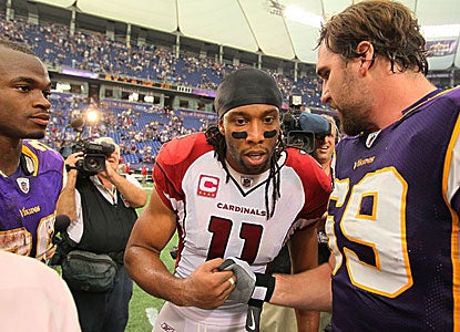  Larry Fitzgerald (only four catches, 66 yards) greets Jared Allen as Adrian Peterson looks on.  (Getty Images)