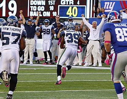 Seattle's Brandon Browner (39) runs in for the score after picking off New York's Eli Manning. (US Presswire)