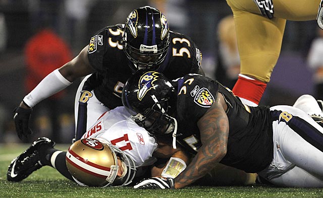 Alex Smith gets buried, and so seemingly do the 49ers' chances of challenging the Packers. (Getty Images)