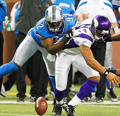 Detroit's Cliff Avril forces Minnesota's Joe Webb to fumble on the final play of the game. (Getty Images)