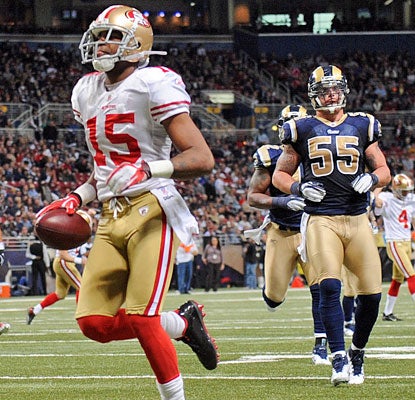 Michael Crabtree has an easy jog into the end zone after catching a pass on a fake field goal try.  (AP)