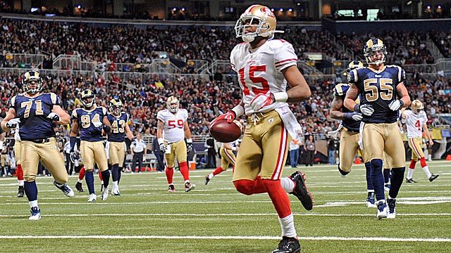 Michael Crabtree scores on a fake field goal after pretending to run off the field. (AP)