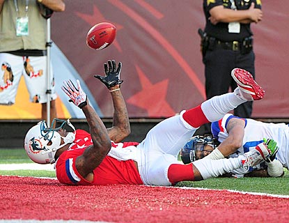 Brandon Marshall keeps his eye on the ball and winds up making an acrobatic touchdown catch in the third quarter.  (US Presswire)