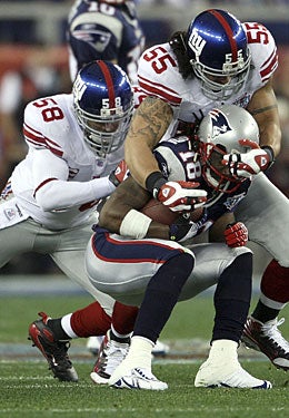 Super Bowl XLII 'backers Antonio Pierce and Kawika Mitchell helped the D. (Getty Images)