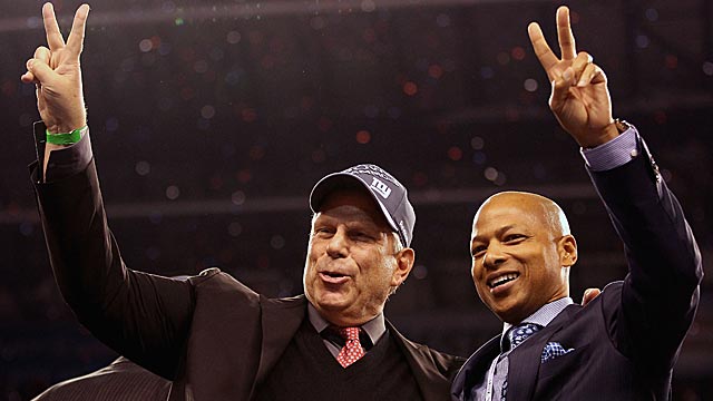 Co-owner Steve Tisch shares the moment with his now-brilliant GM, Jerry Reese. (Getty Images)