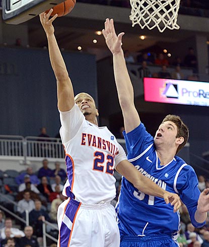 Evansville guard Ned Cox goes up for a shot against Creighton's Will Artino during the second half.  (AP)