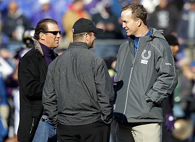 Peyton Manning chats with Ravens officials before the Colts game in Baltimore this season. (Getty Images)