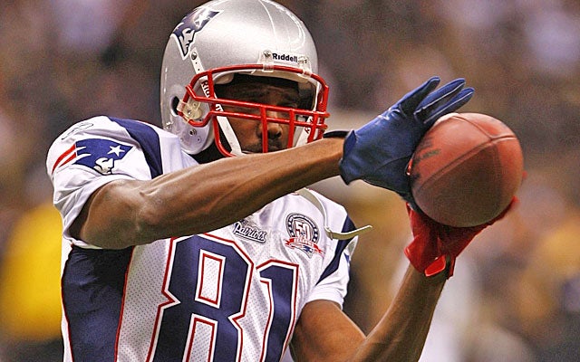 Randy Moss had 28 catches for 393 yards and five TDs in 2010 for the Pats, Vikings and Titans. (Getty Images)