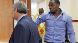 Defense attorney Harvey Steinberg and Perrish Cox walk into the courthouse Thursday.