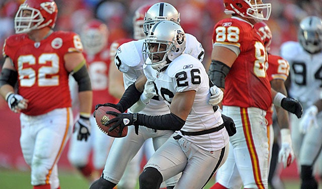 Former Raiders DB Stanford Routt celebrates an INT against the Chiefs, his new employer. (US Presswire)