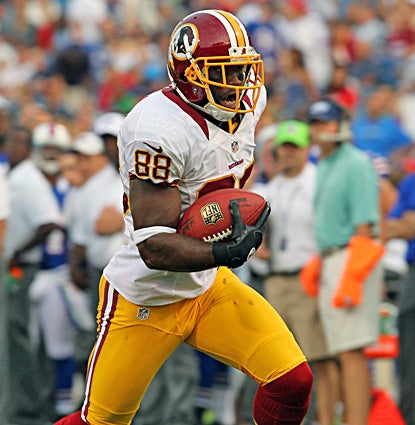 Pierre Garcon catches three passes for 58 yards, including a 20-yard TD reception. (US Presswire)
