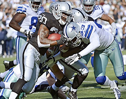 Darren McFadden looks like he's ready to start the season after gaining 38 yards on Oakland's first three plays of the game. (Getty Images)