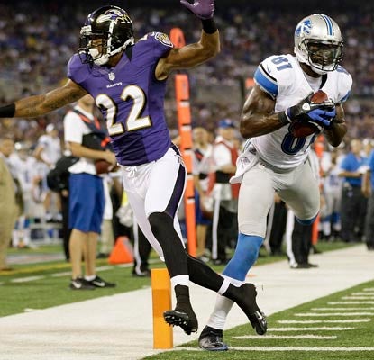 Calvin Johnson hauls in an 18-yard touchdown over Jimmy Smith and finishes the night with 111 receiving yards.  (AP)