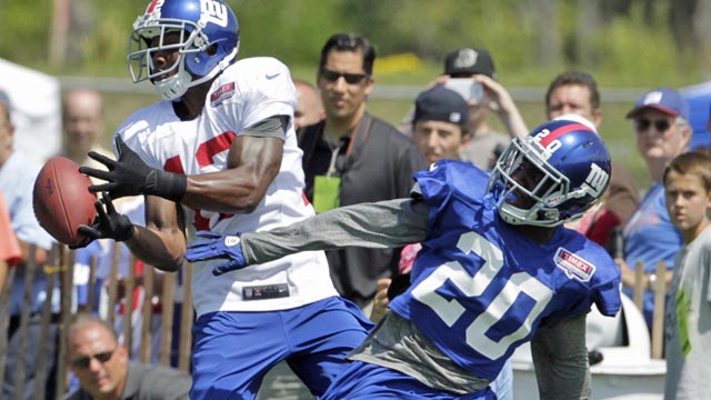 Prince Amukamara (20) took an ice bath courtesy of teammate Jason Pierre-Paul. (US Presswire)