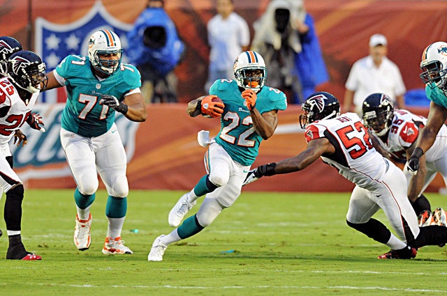 A healthy and productive Reggie Bush should only help Ryan Tannehill's development. (US Presswire)