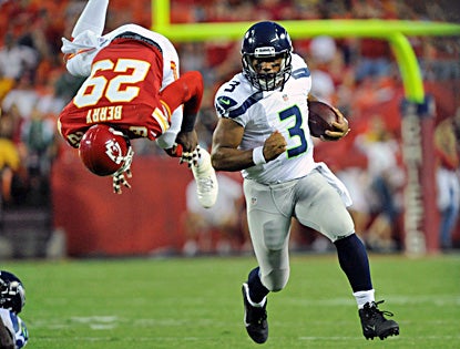 Russell Wilson makes his case for the starting QB job, throwing for 185 yards and two touchdowns. (US Presswire)
