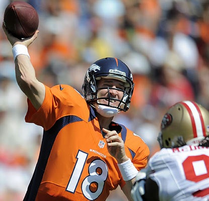 Peyton Manning finishes 10 of 12 for 122 yards and throws two touchdowns, both to WR Eric Decker. (AP)