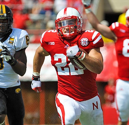 Rex Burkhead busts loose for a career-long 57-yard TD run before leaving the game with a knee sprain.  (AP)