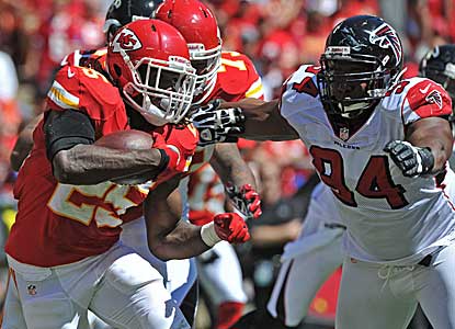 Jamaal Charles looks for running room against the Falcons. Charles runs for 87 yards, but it's not enough for Kansas City.  (Getty Images)