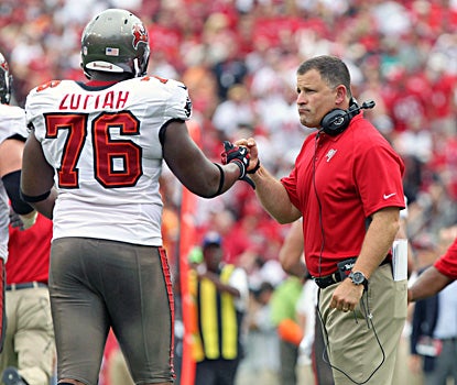 Greg Schiano, making his debut as Bucs coach, congratulates Jeremy Zuttah after a touchdown. (US Presswire)