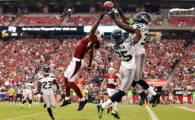 Kam Chancellor breaks up a pass intended for Larry Fitzgerald. (Getty Images) 