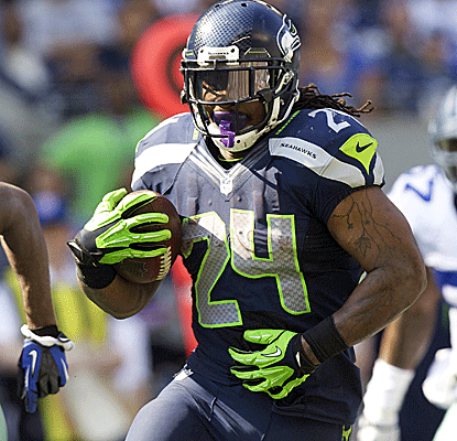 Marshawn Lynch is in beast mode against Dallas, running for 122 yards to help Russel Wilson to his first NFL win.  (Getty Images)