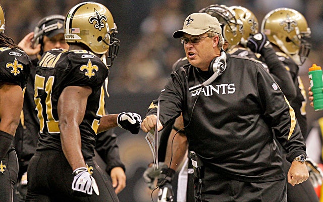Williams says Jonathan Vilma (left) offered $10,000 to knock Brett Favre out of a game in 2009. (US Presswire)