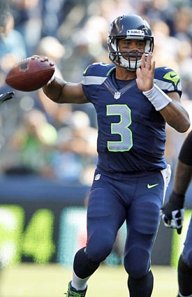 Russell Wilson will have to be on his toes against the Packers' dangerous pass rush. (AP)