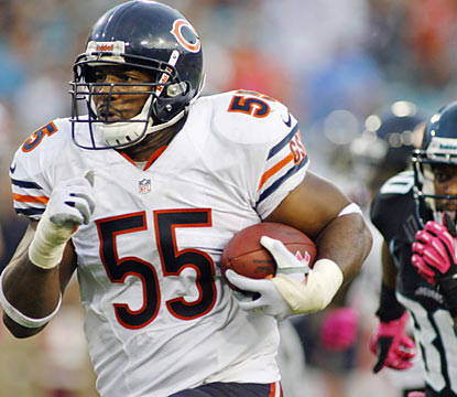 Lance Briggs and the Bears' defense yield just three points and finish with two defensive TDs, two picks and three sacks. (US Presswire)
