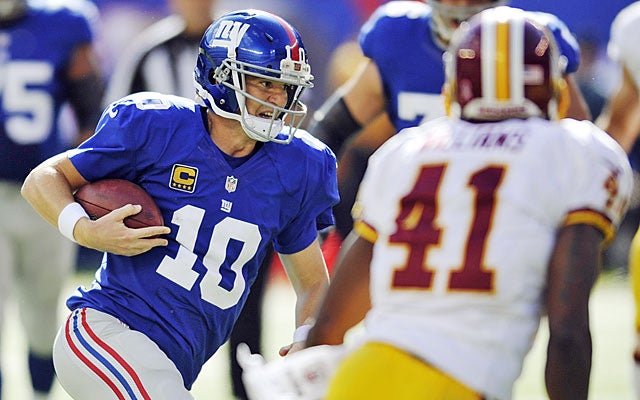 Eli Manning doesn't scare anyone running, but leading the Giants down in the fourth quarter? Terrifying. (AP)