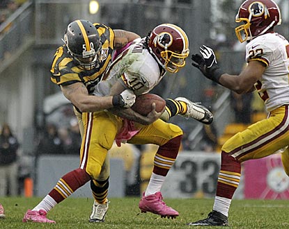 Inside linebacker Larry Foote and the swarming Steelers defense make it a long day for RG3.  (AP)