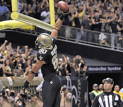 Saints TE Jimmy Graham, who finishes with a career-high 146 yards, celebrates one of his touchdowns on the day. (AP)