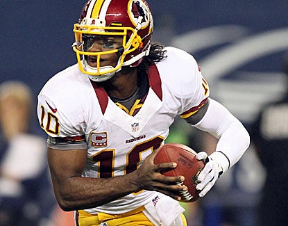 Redskins rookie QB Robert Griffin III throws for 311 yards and four touchdowns against the Cowboys. (US Presswire)