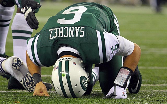 At some point during a disastrous second quarter, Mark Sanchez must have wanted to dig a hole. (US Presswire)