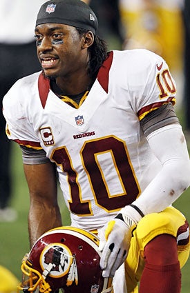 Robert Griffin III and the Redskins can't afford to lose Monday night. (AP)