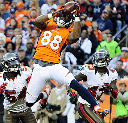 Demaryius Thomas collects two of Peyton Manning's three touchdowns as Denver clinches the AFC West.  (US Presswire)