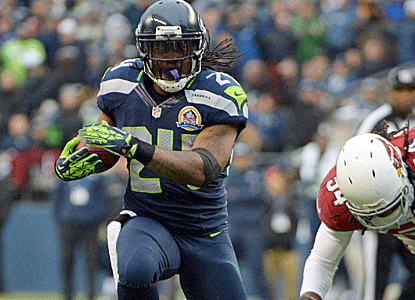 Marshawn Lynch scores three touchdowns in just over a half of play as Seattle runs all over the Cardinals.  (US Presswire)