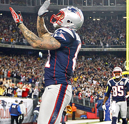 Aaron Hernandez celebrates one of his two touchdown catches as New England overpowers the Texans.  (Getty Images)