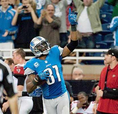 Calvin Johnson salutes the crowd after passing Jerry Rice for the single-season yards receiving mark of 1,848. (US Presswire)