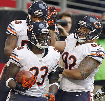 Charles Tillman returns an interception for a touchdown for the third time this season as the Bears' defense hampers the Cards. (AP)