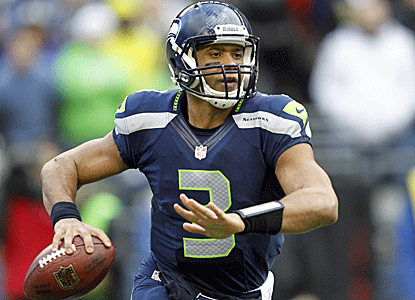 Russell Wilson ties Peyton Manning for most TD passes by a rookie with 26, and Seattle wins again at home.  (US Presswire)