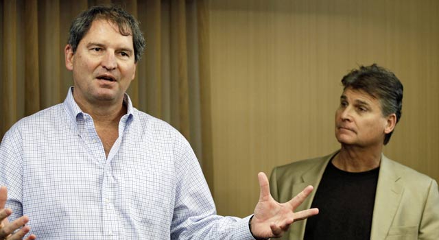 Bernie Kosar (left), pictured with Dr. Rick Sponaugle, says his symptoms are going away. (AP)