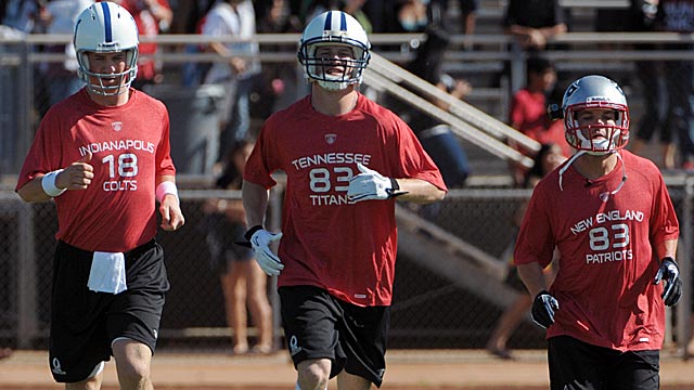 Peyton Manning (left) towers over Welker at the Pro Bowl in January of 2011.  (USATSI)
